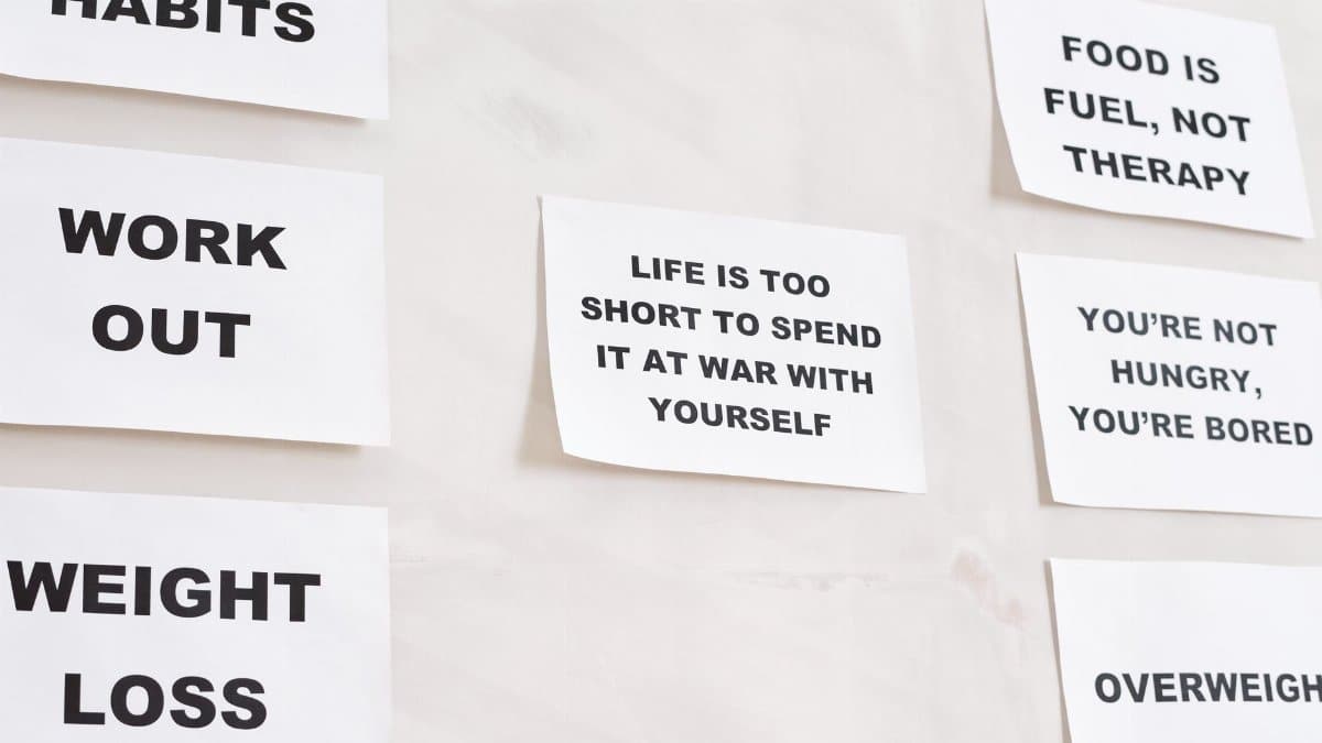 Motivational quotes on white paper promoting healthy habits and lifestyle changes.