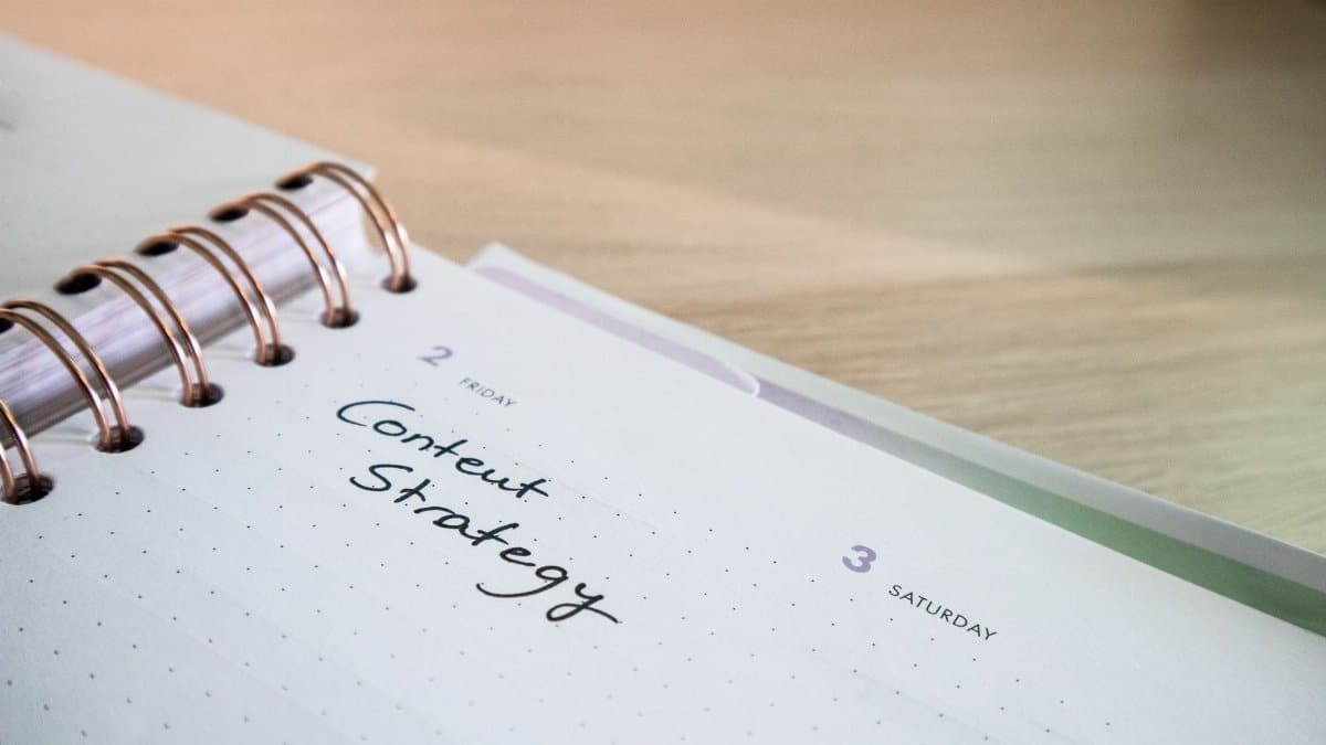 Close-up of a notebook page with 'Content Strategy' written on it, ideal for business planning visuals.