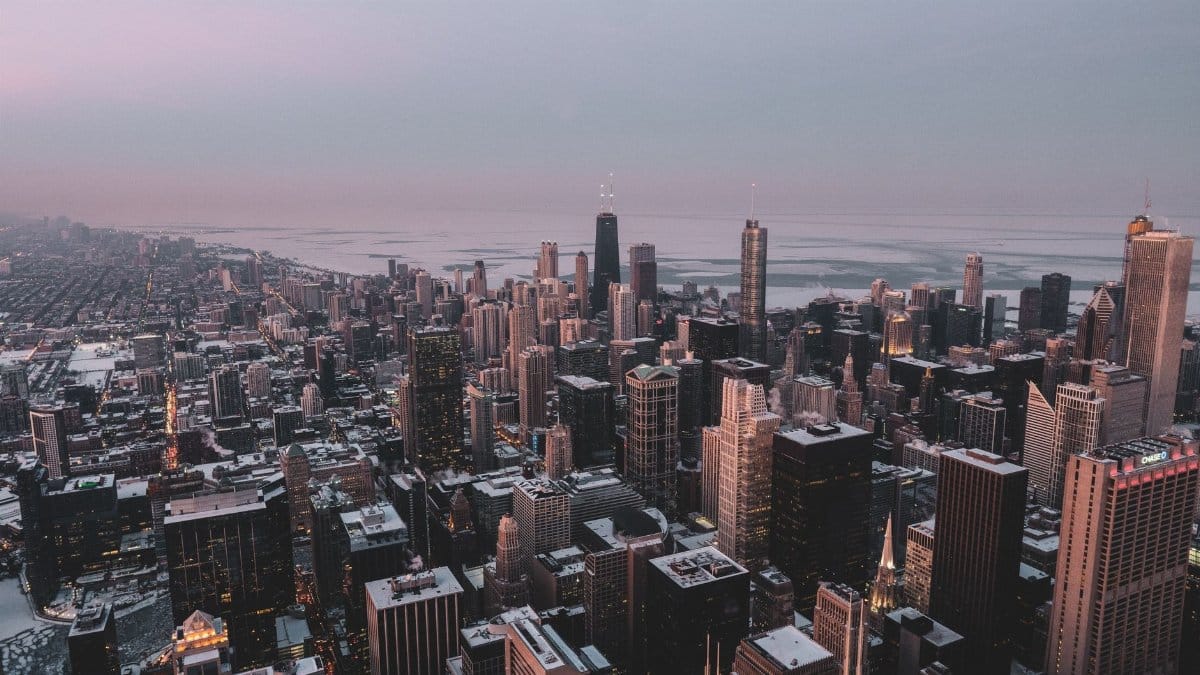 Stunning aerial view of Chicago's winter skyline at dusk, showcasing skyscrapers and urban landscape.