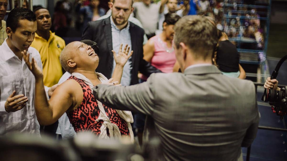 An emotional scene capturing intense expressions during a crowded event.