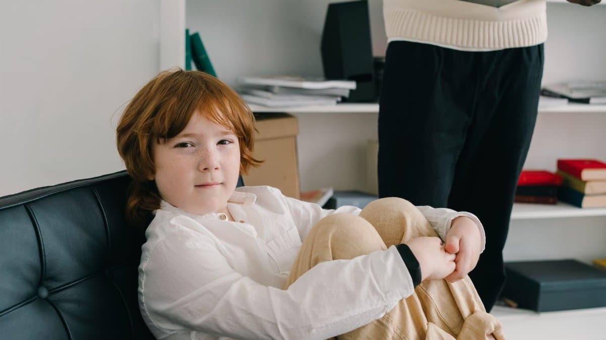 A young boy in a therapy session sitting comfortably indoors, emphasizing child development.