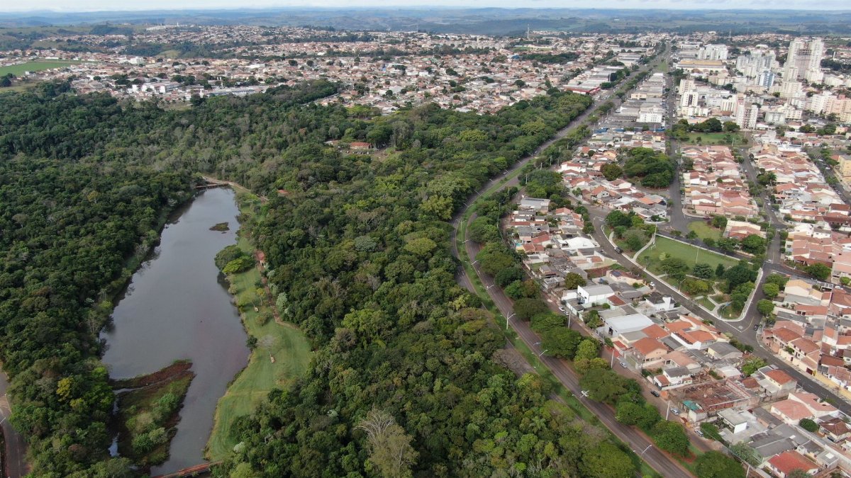 Drone shot of urban and forest landscape in Califórnia, PR, Brazil.