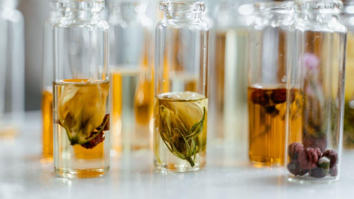 Glass bottles with floral infusions perfect for natural aromatherapy and skincare.