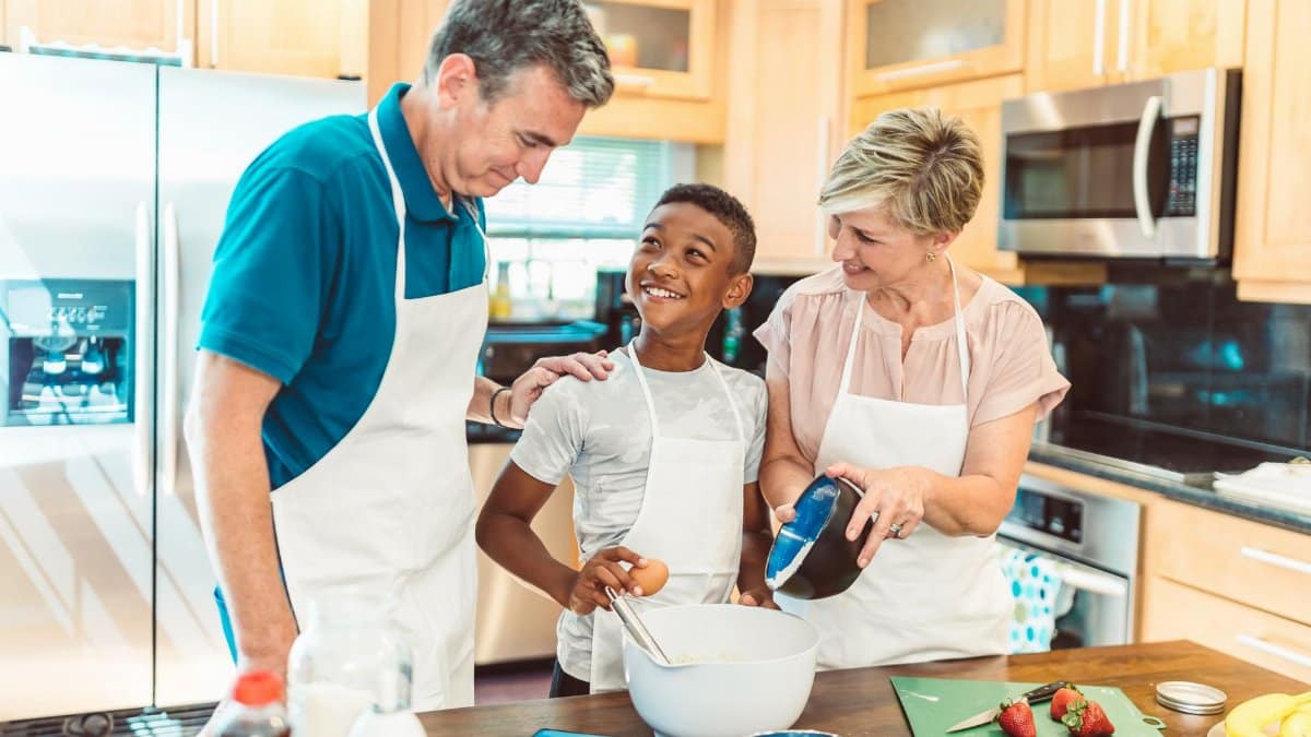 Happy family bonding in the kitchen, baking together and creating memories.