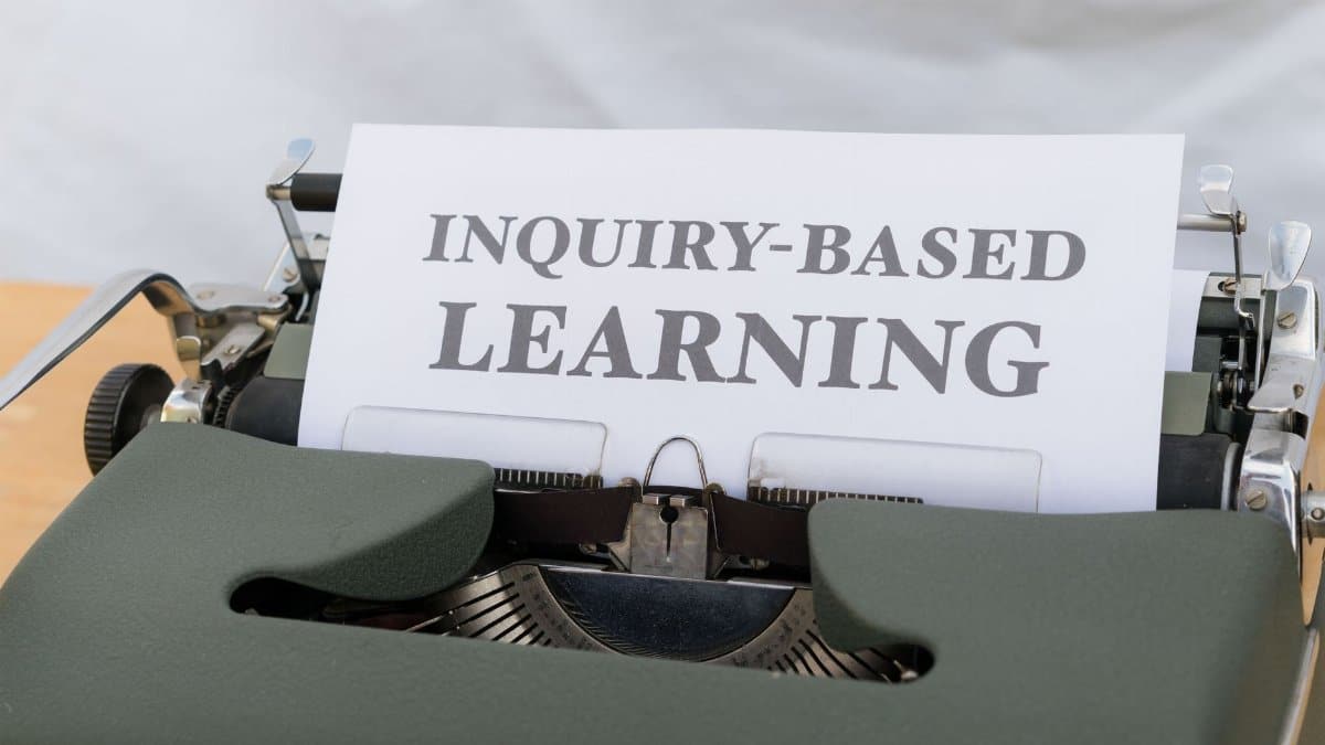 Vintage typewriter displaying 'Inquiry-Based Learning.'