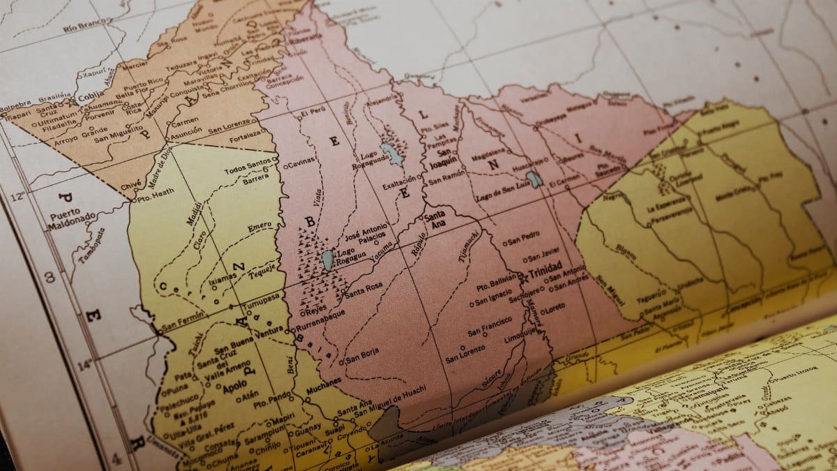 Detailed vintage map showing geographic regions in an old atlas book, highlighting Mérida, Venezuela.