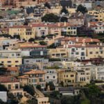 Colorful residential neighborhood in San Francisco with diverse architecture and dense housing.