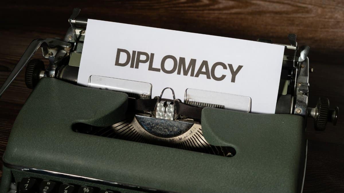 Close-up of a vintage typewriter with the word 'Diplomacy' on a paper sheet.