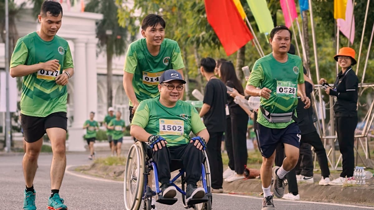 A group of men participating in a marathon in Can Tho, Vietnam, some in wheelchairs.