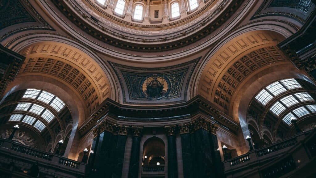 A stunning view of the intricately decorated dome inside the Wisconsin State Capitol, Madison.