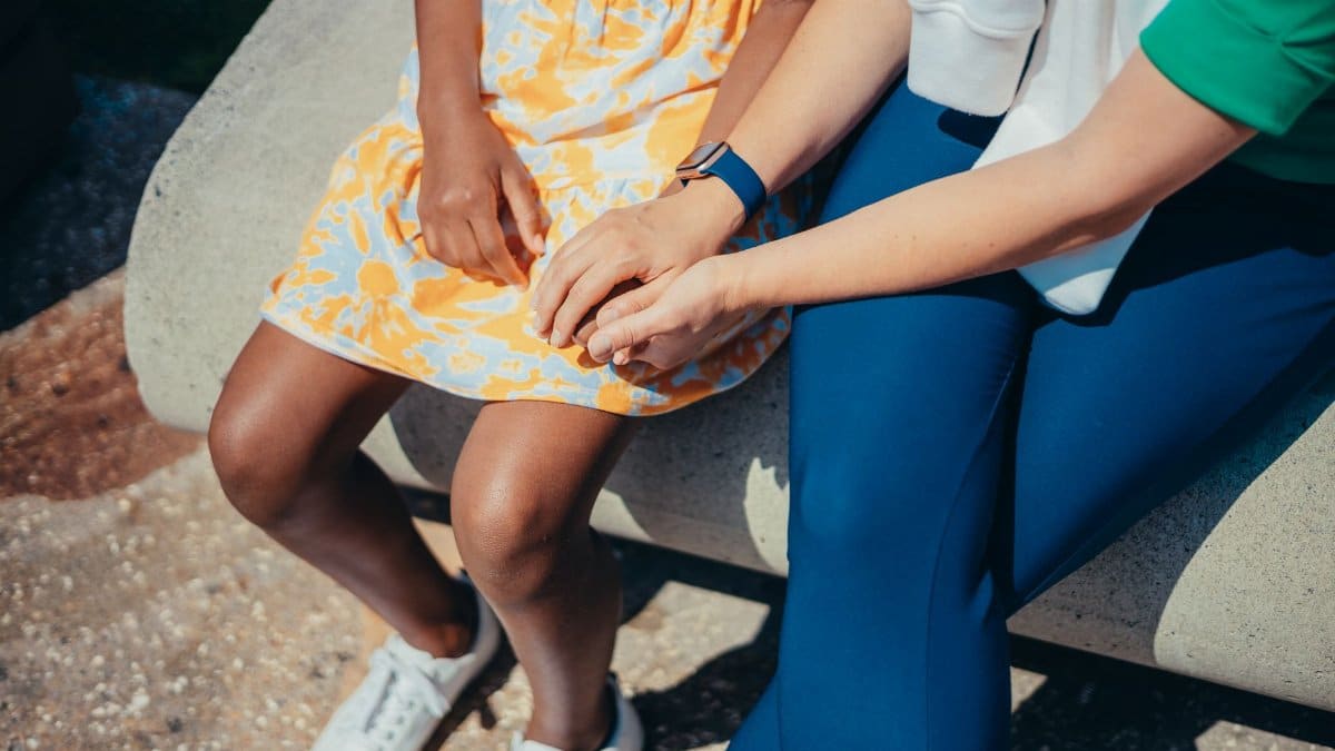 A heartwarming outdoor scene showing two people bonding, highlighting togetherness and care.