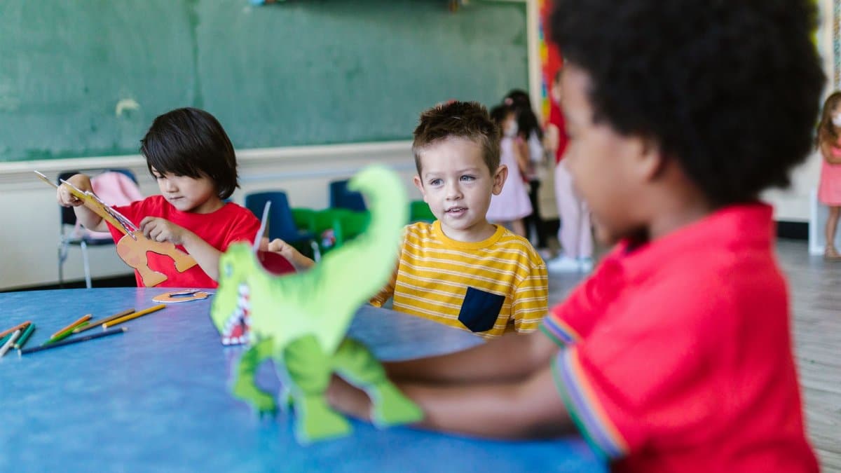 Kids engaging in play and learning activities in a vibrant classroom.