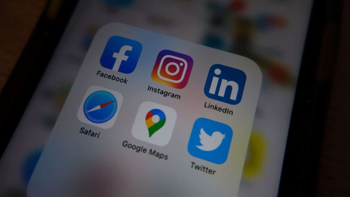 Close-up view of popular social media app icons on a smartphone screen.