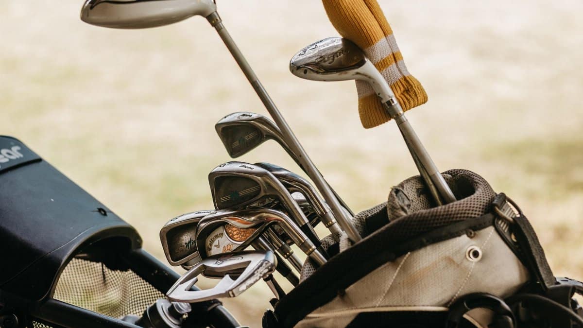 A detailed close-up of golf clubs in a bag, perfect for sports enthusiasts.