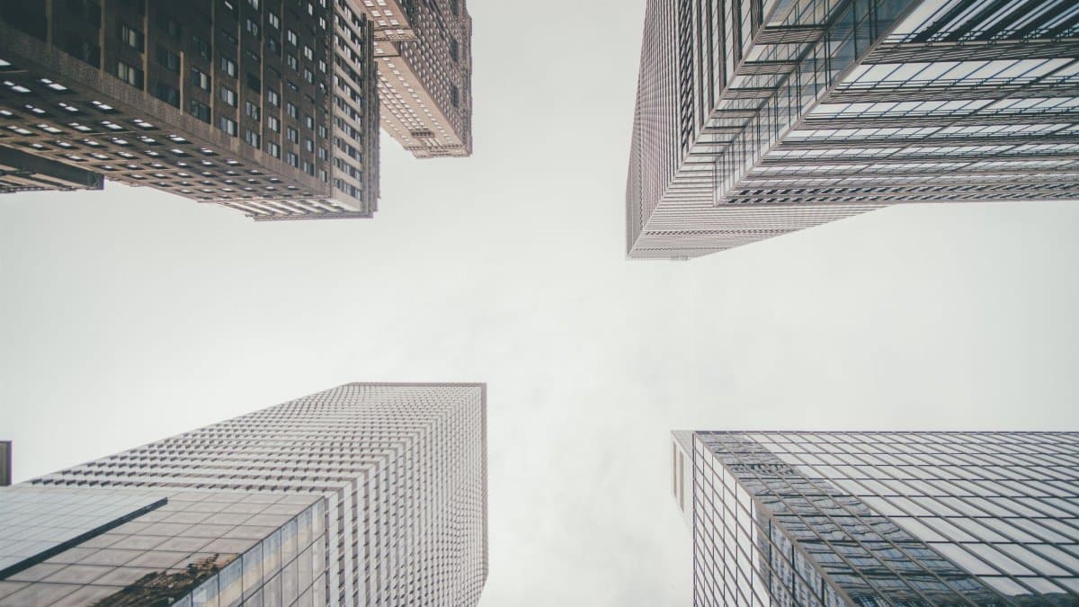 Captivating perspective of modern skyscrapers reaching into the sky in an urban setting.