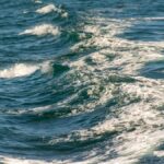 Captivating image of ocean waves with white foam under daylight.
