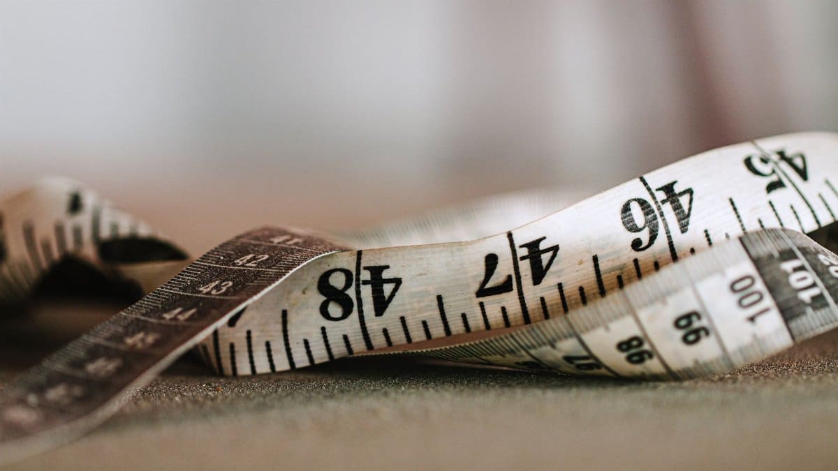 Detailed close-up of a measuring tape showing precise numbers and units