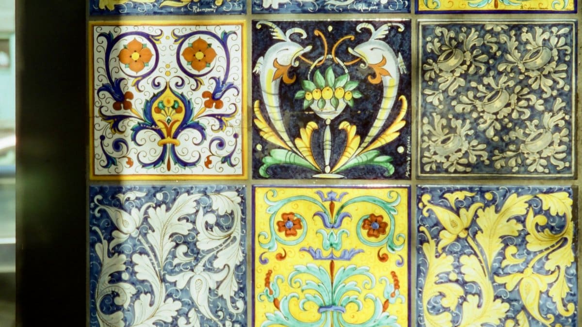 Vibrant, detailed ceramic tiles showcasing intricate floral patterns and vivid colors.