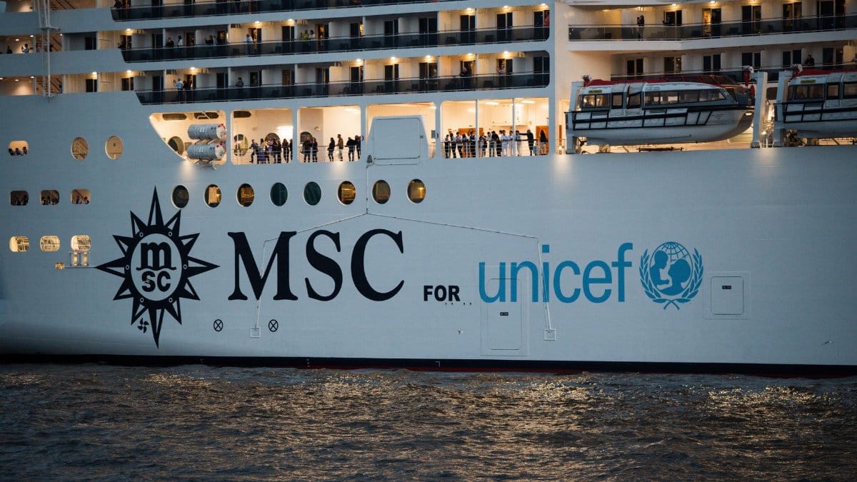 MSC cruise ship displaying its collaboration with UNICEF during an evening voyage on water.
