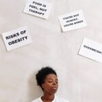 African American woman with health messages about nutrition and obesity awareness.