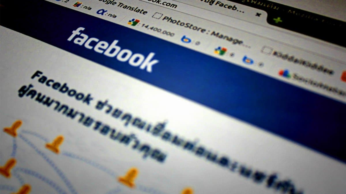 High-angle shot of the Facebook website homepage displayed on a computer screen in Thai language.