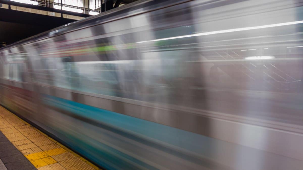 Dynamic capture of a fast-moving subway train in NYC, showcasing urban transit motion.