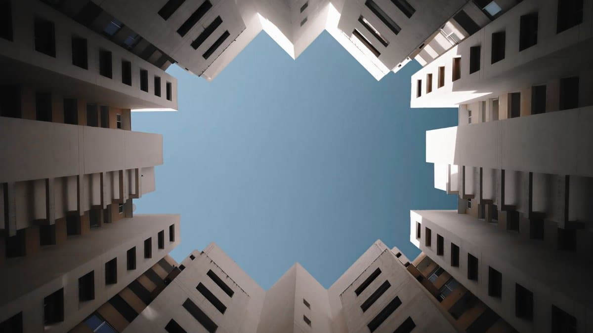 Modern buildings forming a geometric pattern against clear sky in Bengaluru, India.