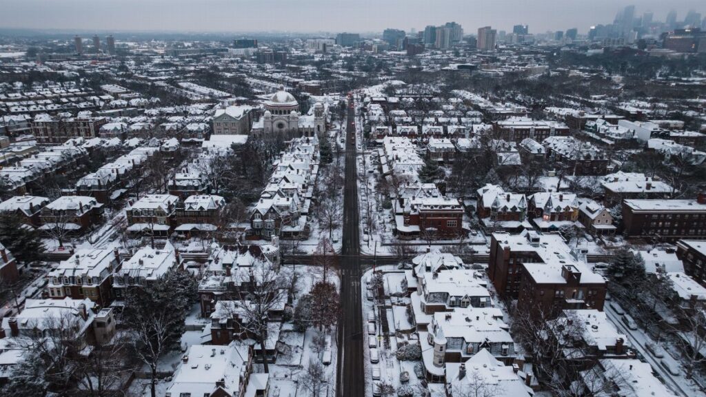 A stunning aerial shot of snow-covered streets and buildings in Philadelphia during winter.