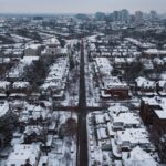 A stunning aerial shot of snow-covered streets and buildings in Philadelphia during winter.