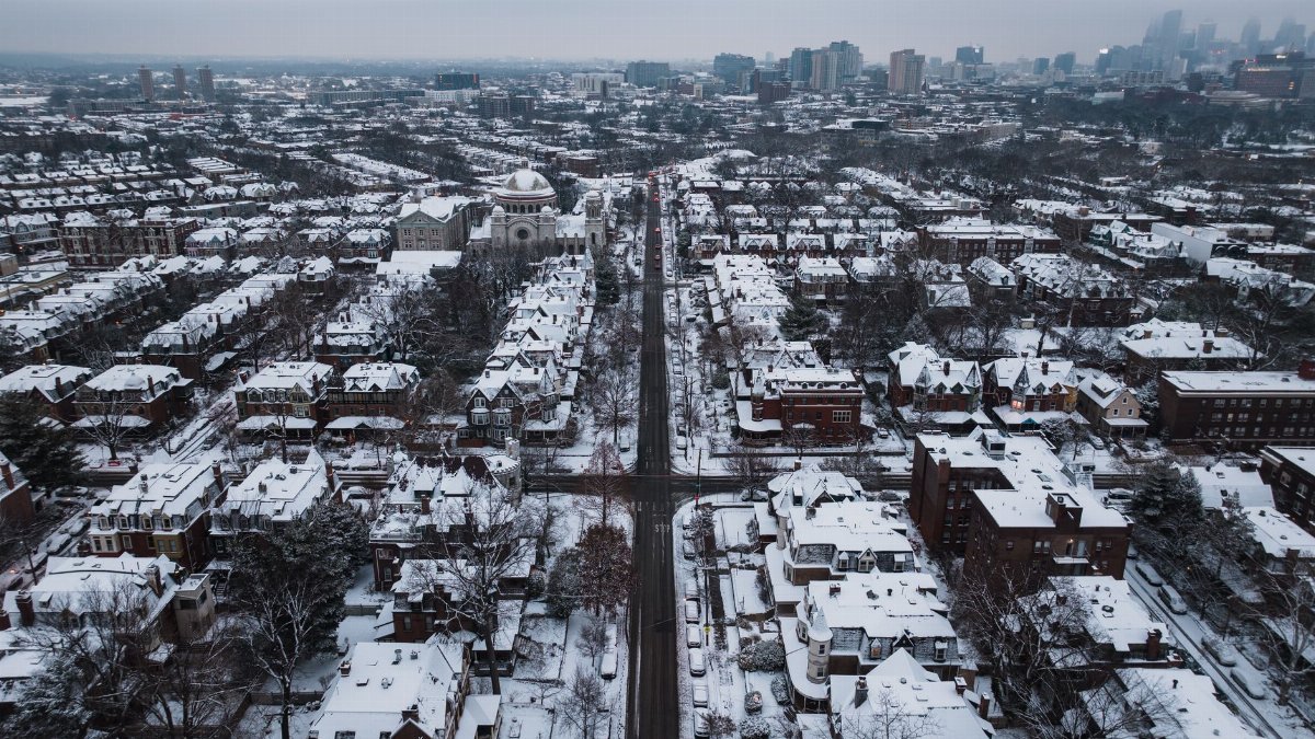A stunning aerial shot of snow-covered streets and buildings in Philadelphia during winter.