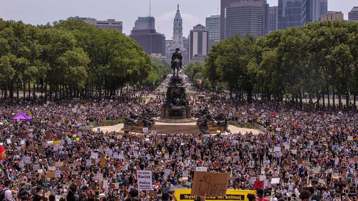 Large protest at Eakins Oval in Philadelphia, highlighting activism and unity.
