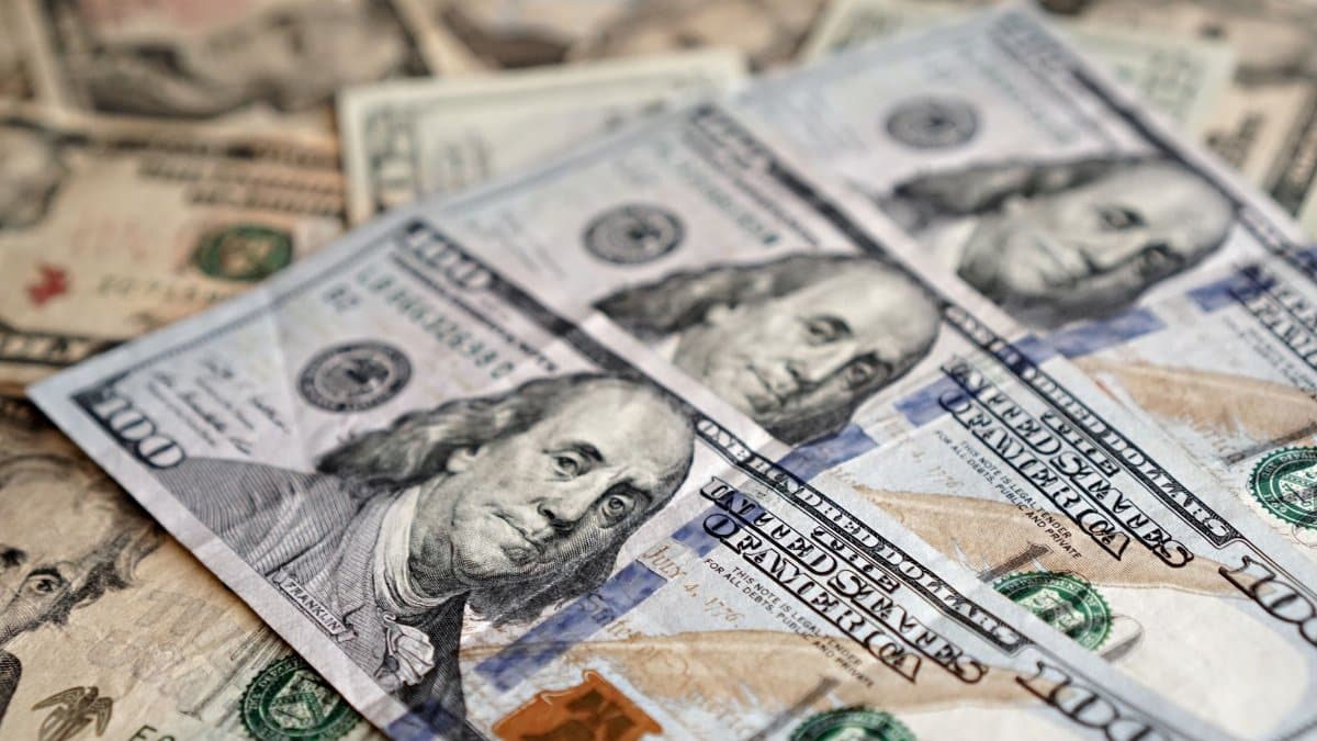 A stack of US dollar bills representing wealth, investment, and economic concepts.