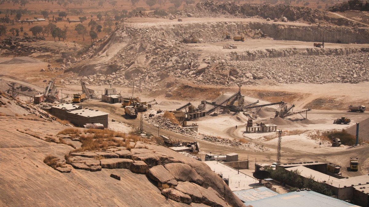 Aerial shot of a large quarry in Kaduna, Nigeria, during the day.
