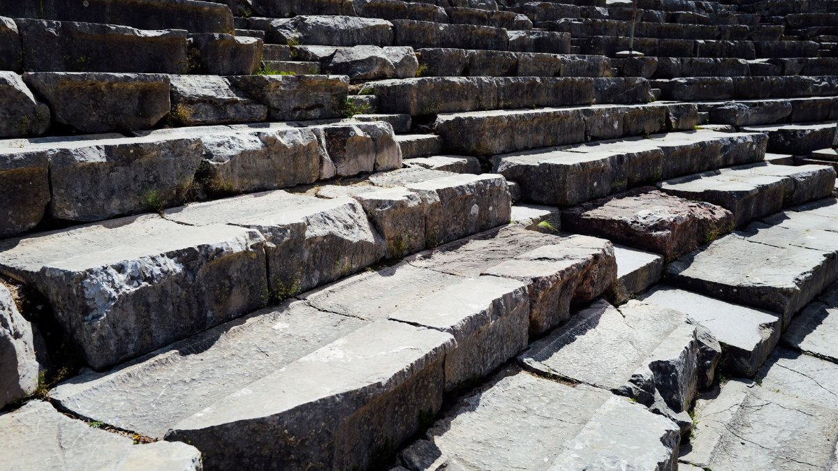 Explore the weathered charm of ancient stone steps bathed in natural light.