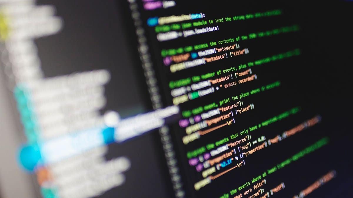 Close-up of a computer screen displaying colorful programming code in JavaScript.