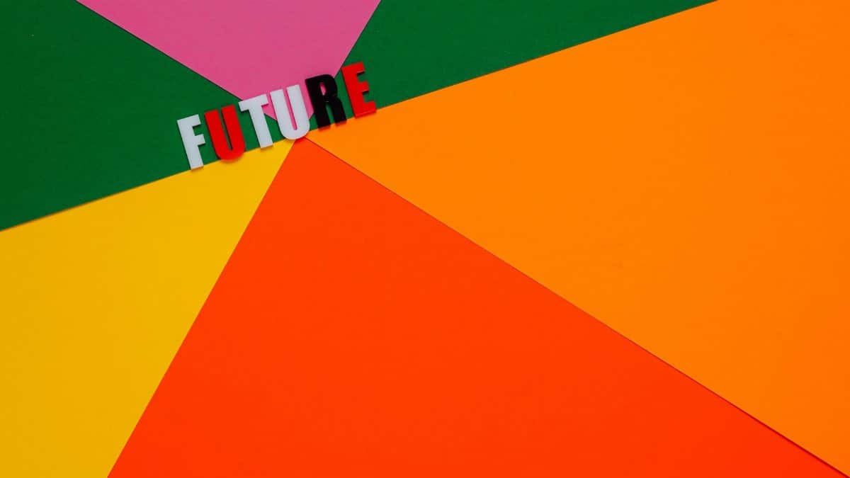 Dynamic abstract image with colorful paper background and 'Future' text.