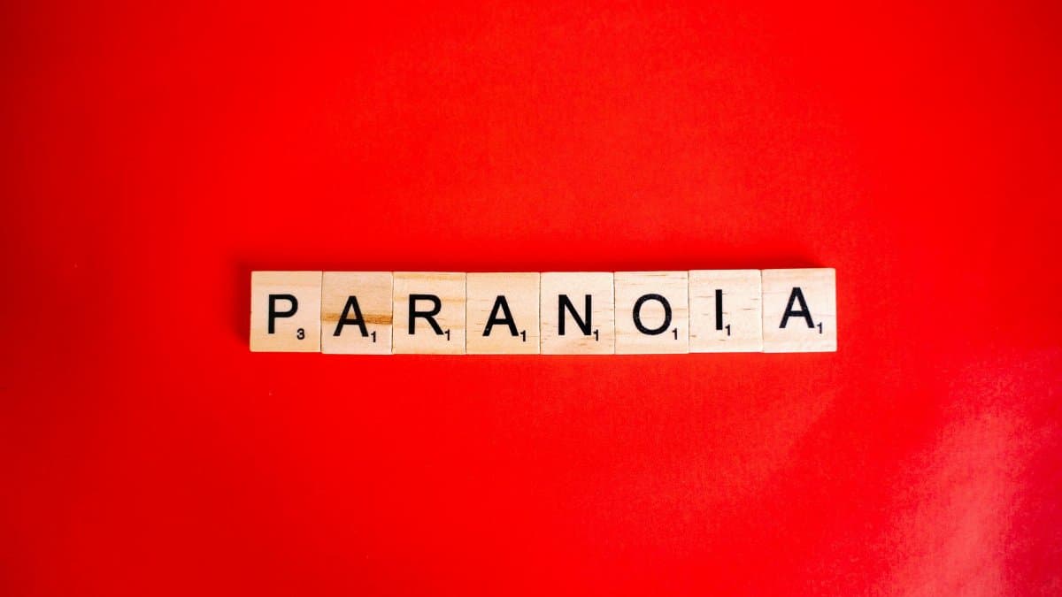 Scrabble tiles spell 'Paranoia' against a bold red background.