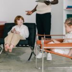 Children engaging in a therapy session with therapist in a modern office.