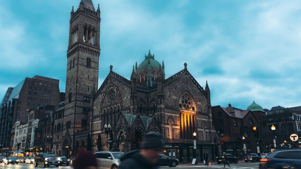 View of the iconic Old South Church with traffic at twilight in Boston, Massachusetts.