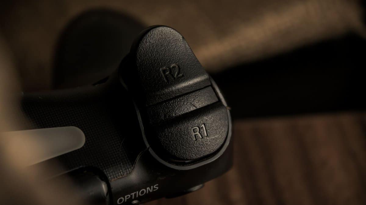 Detailed close-up of R1 and R2 triggers on a gaming controller.