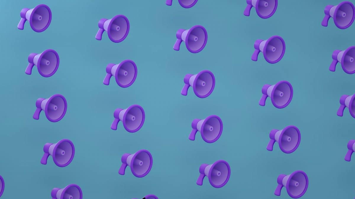 Bright purple megaphones pattern on a blue backdrop creating an abstract and modern visual.