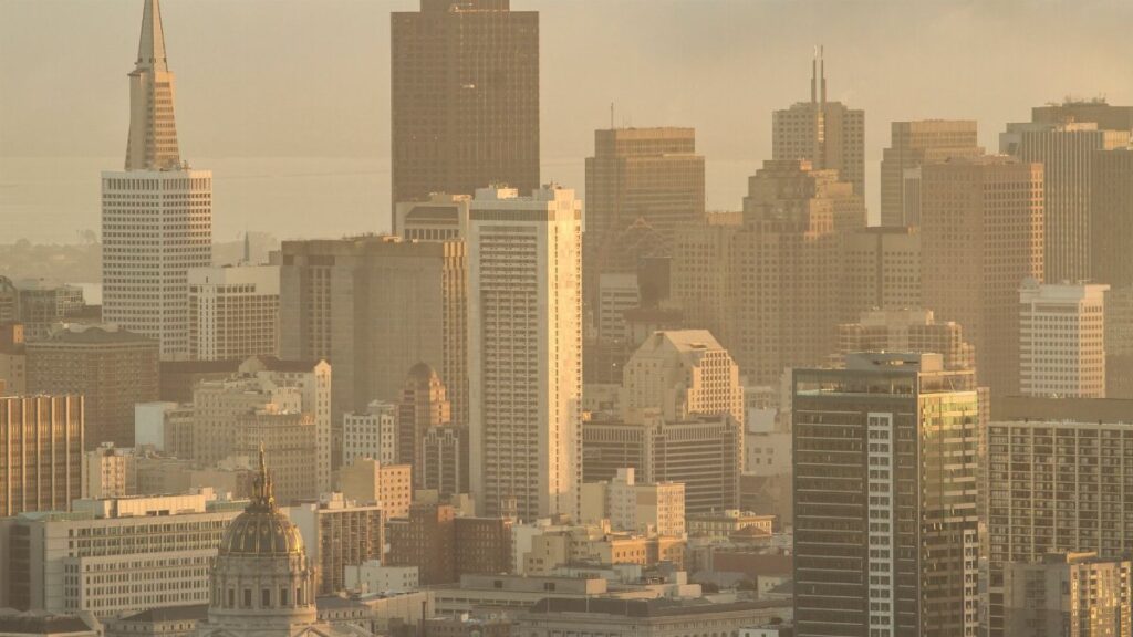 A beautiful view of the San Francisco skyline featuring the iconic Transamerica Pyramid during sunset.