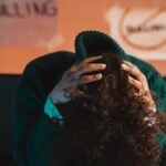 A person in distress, highlighting bullying awareness and mental health issues with a focus on anti-bullying.
