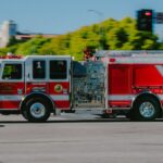 Fire truck from Santa Monica Fire Department in motion on a city street.