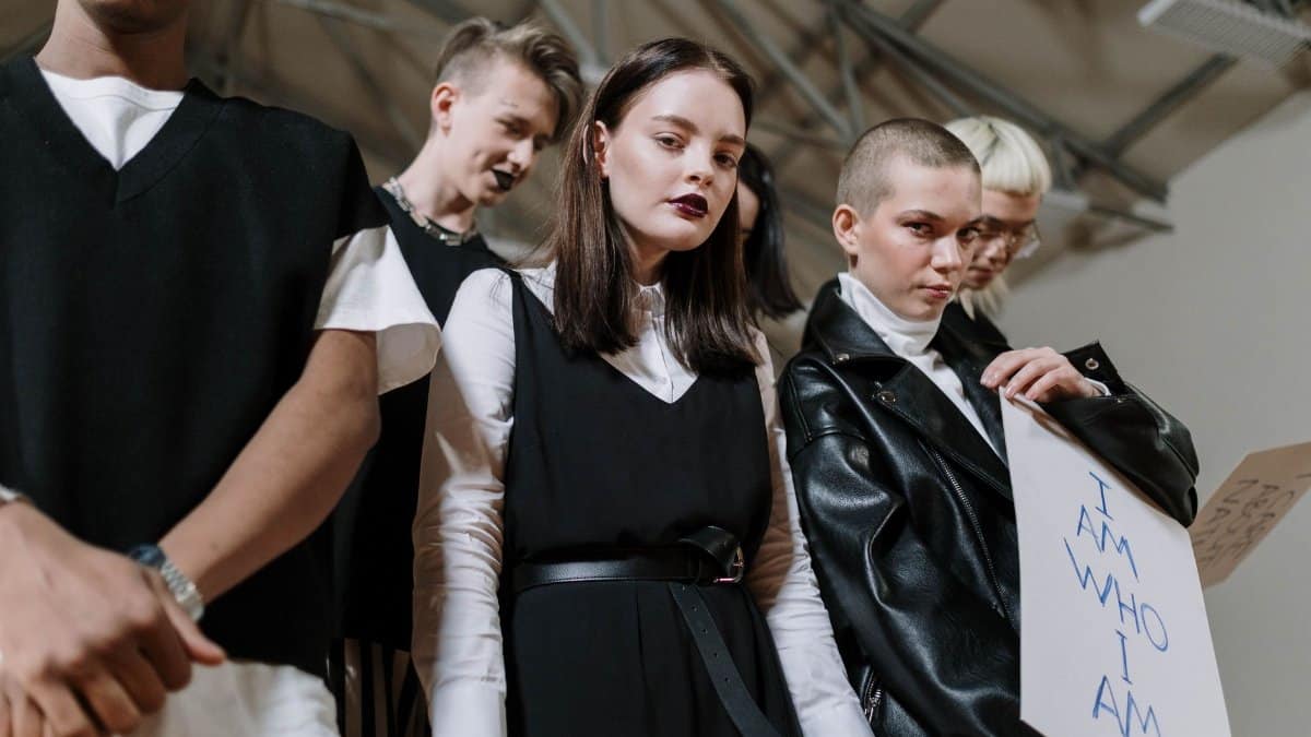 A diverse group of Gen Z individuals showcasing unique style and fashion indoors.