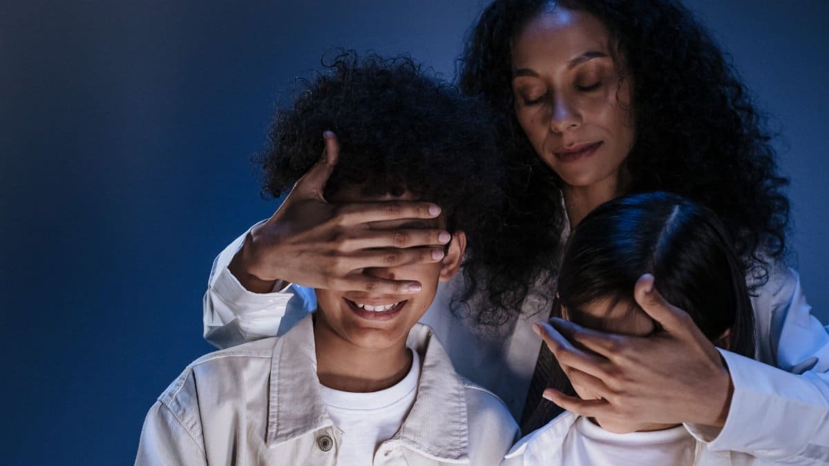 Mother guides her children with love and protection, symbolizing online safety and privacy.