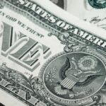 Detailed macro shot of a United States one dollar bill showing various design elements.