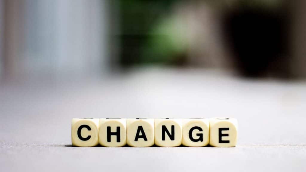 Close-up of letter blocks spelling 'CHANGE', symbolizing transformation and growth.