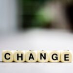 Close-up of letter blocks spelling 'CHANGE', symbolizing transformation and growth.