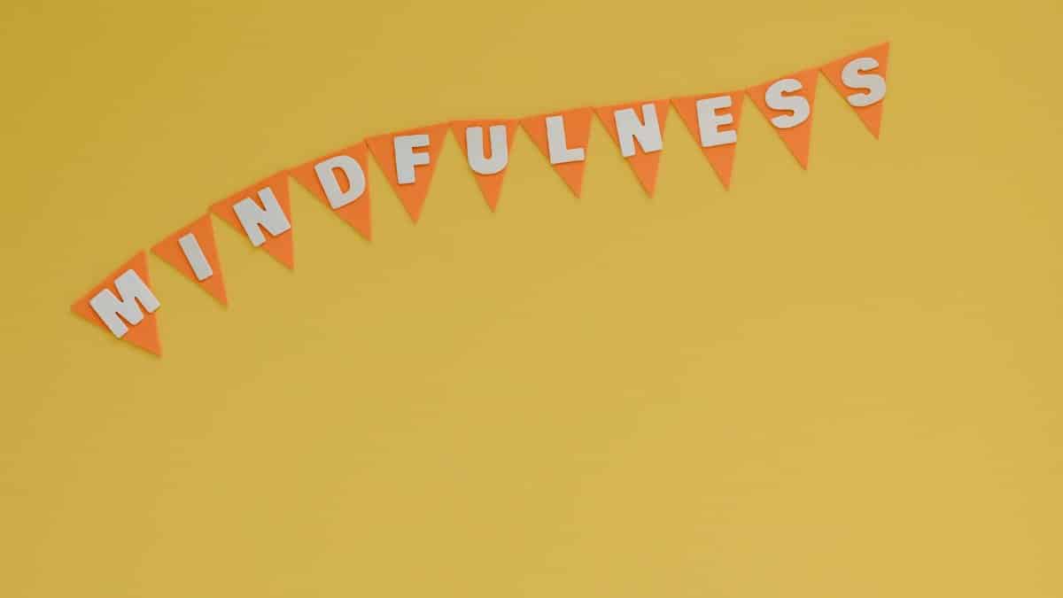 Banner with 'Mindfulness' on a bright yellow background, symbolizing calm and focus.
